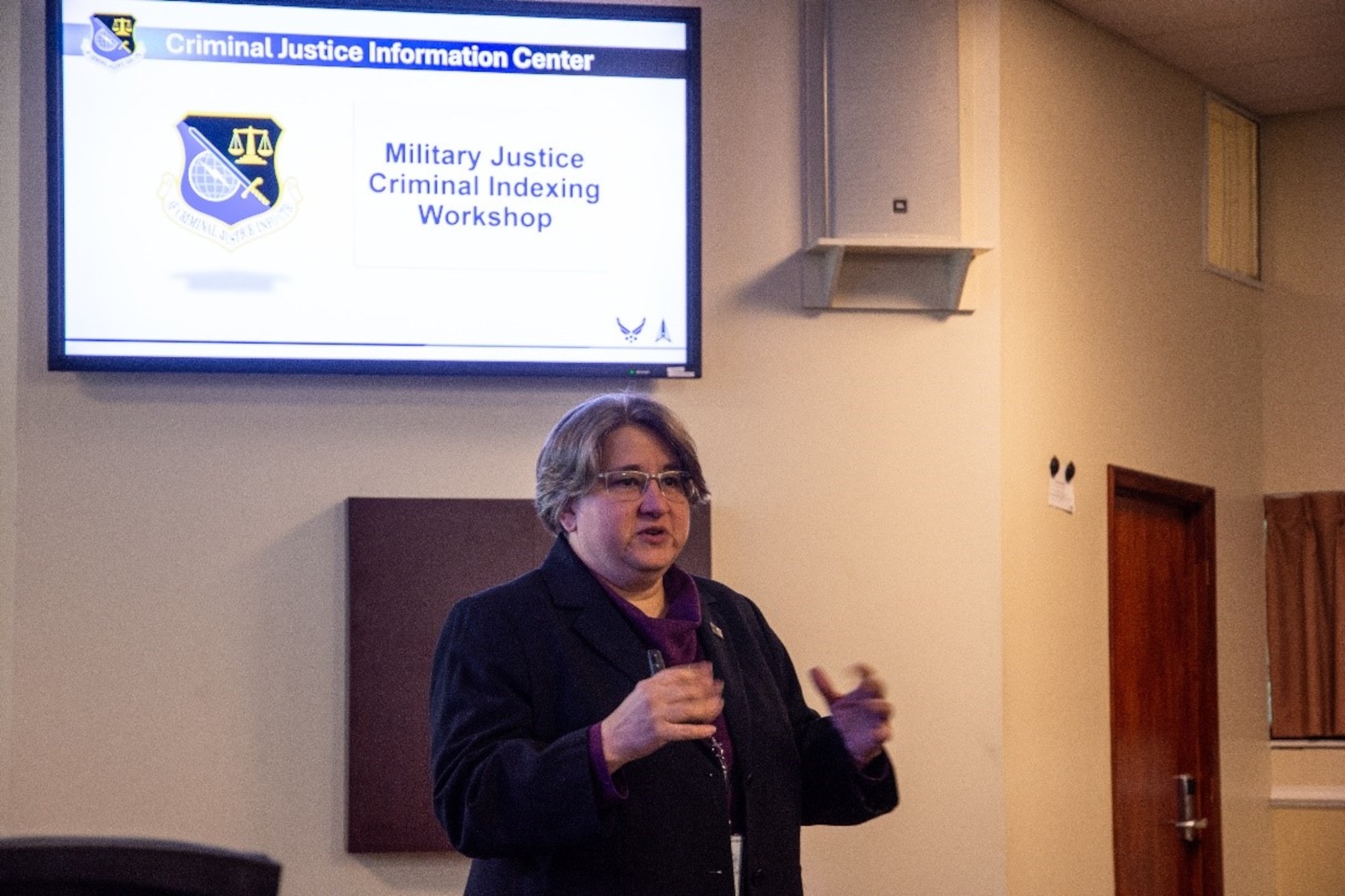 Special Agent Julie Lecea, director of the Air Force Criminal Justice Information Center, delivers opening remarks at a two-day Criminal Indexing Workshop, Oct. 29, 2024, at Marine Corps Base Quantico, Va. The workshop gathered over 60 experts from across the Department of Defense and federal agencies to share best practices and identify opportunities for closer engagement in criminal data reporting and sharing information across law enforcement databases. (U.S. Air Force photo by Capt. Justin Clark)