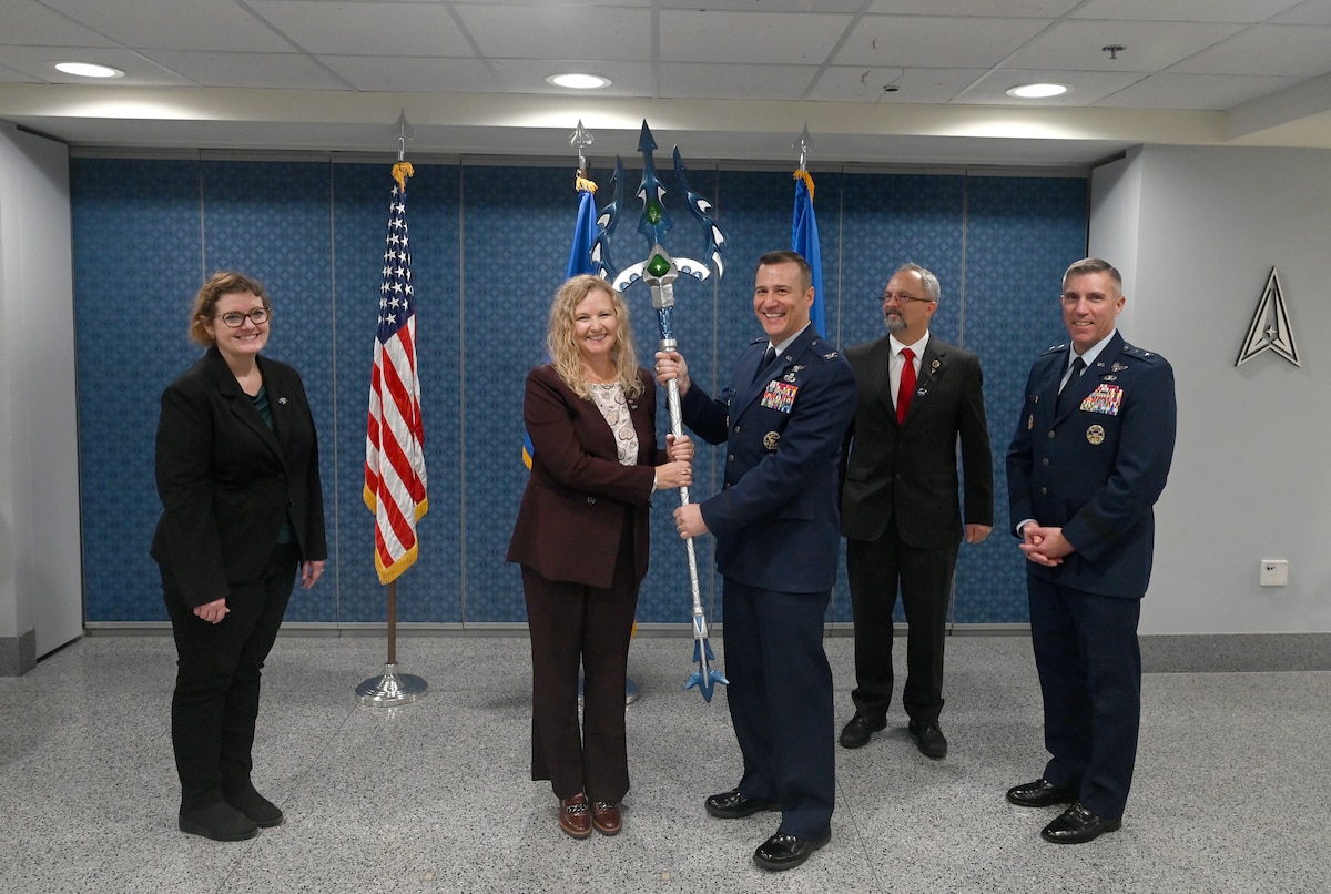 Service members and government officials celebrate their collaboration and the initial operational capability of Global Hydro-Intelligence.