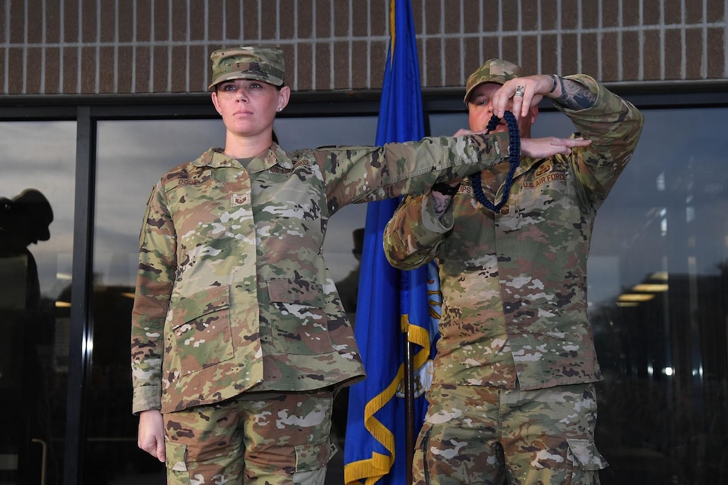 U.S. Air Force Tech. Sgt. Jordan Dodd, 97th Training Squadron master military training leader (MTL), left, receives an MTL aiguillette at Keesler Air Force Base, Mississippi, Nov. 9, 2022. As an MTL, Dodd committed to instilling the Air Force core values in her Airmen. (courtesy photo)