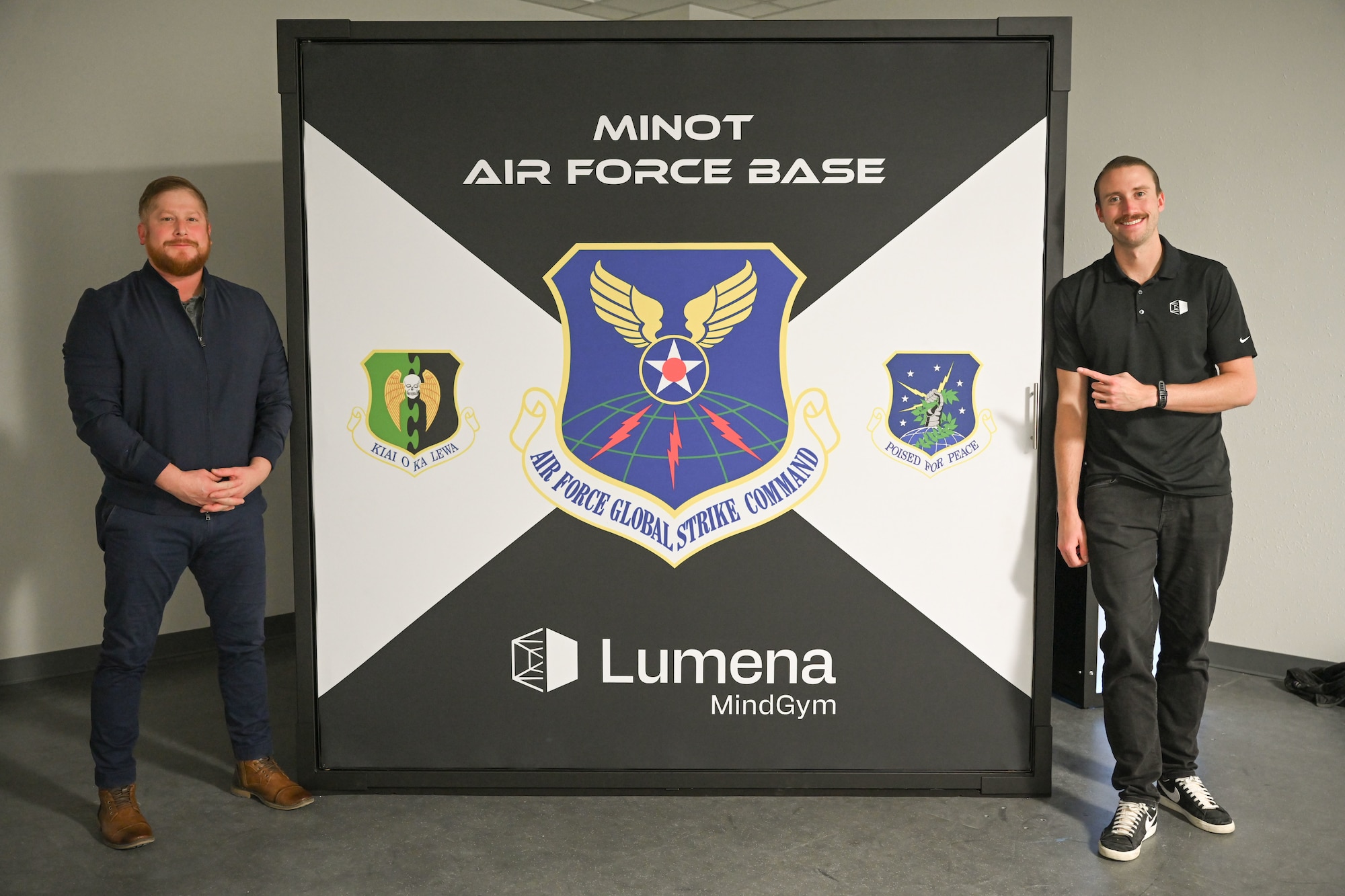 Fabian Perales, True North program manager (left), and Brandon Murphy, Lumena Inc.’s head of growth (right), pose for a photo at McAdoo Fitness Center at Minot Air Force Base, North Dakota, Nov. 15, 2024. The MindGym was created to improve cognitive response and brain function.