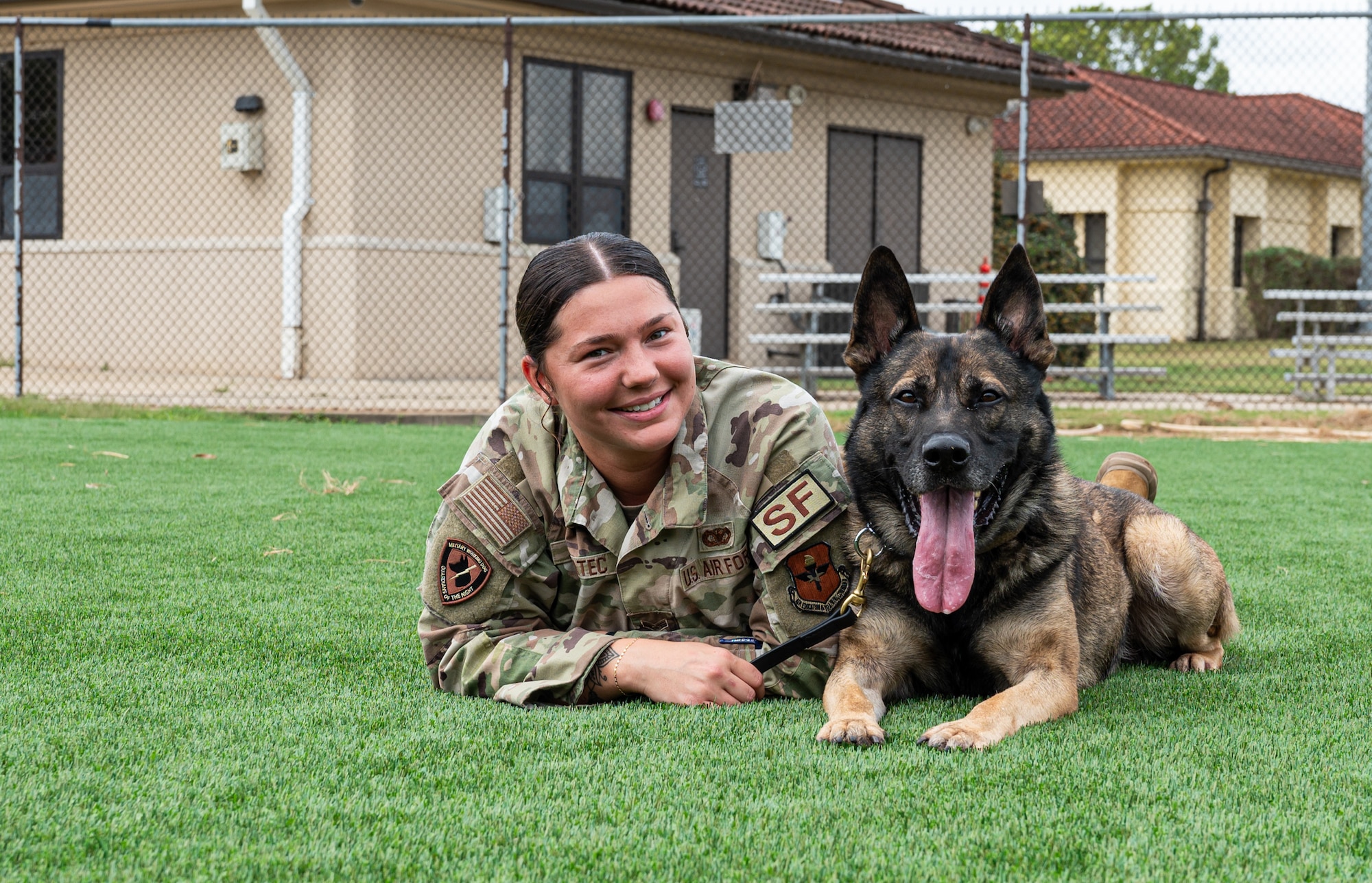 MWD and handler pose for photo