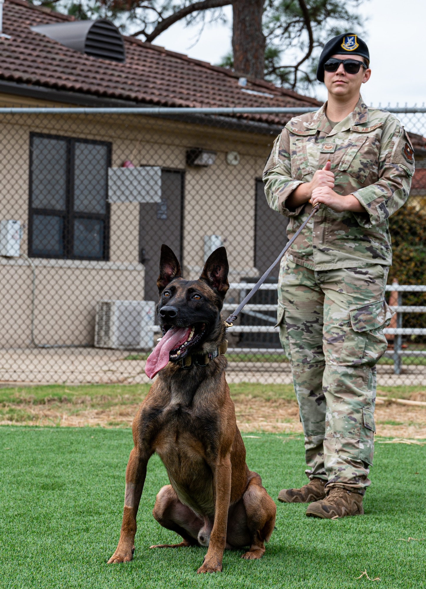 MWD handler and MWD pose for photo