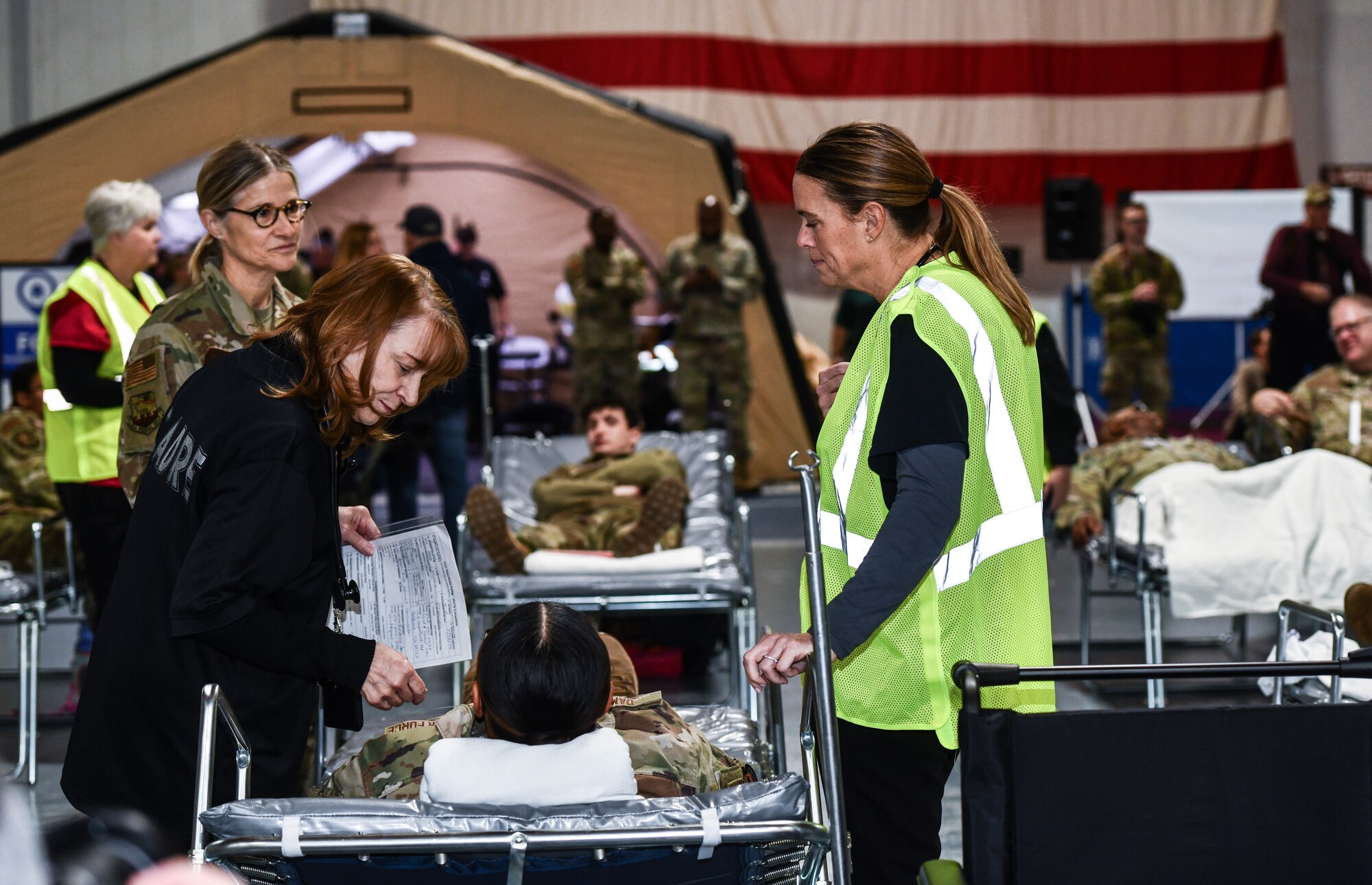 VA, EMS, Omaha Metropolitan Healthcare Coalition and 55th Medical Group personnel triage a patient during a National Disaster Medical System exercise at Offutt Air Force Base, Nebraska Nov. 13, 2024 . The Omaha area is conducting an exercise to determine the preparedness to support an overseas conflict by moving military casualties into the civilian health care network. Participants from local, state, and federal response agencies teamed up with Air Force and the Nebraska Air National Guard to ensure the nation’s capability to support a war effort. (U.S. Air Force photo by Chad Watkins)