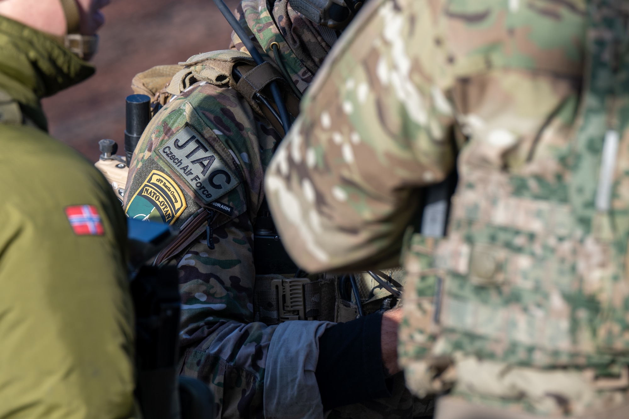 A photo of soldiers talking.