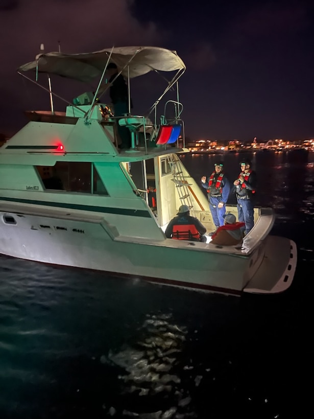 Coast Guard boarding team members attached to the Coast Guard Cutter Narwhal detain 21 migrants aboard a 34-foot boat near Newport Beach, California on Nov. 14, 2024. The individuals were taken into custody and safely transferred to U.S. Customs and Border Protection. (U.S. Coast Guard photo)