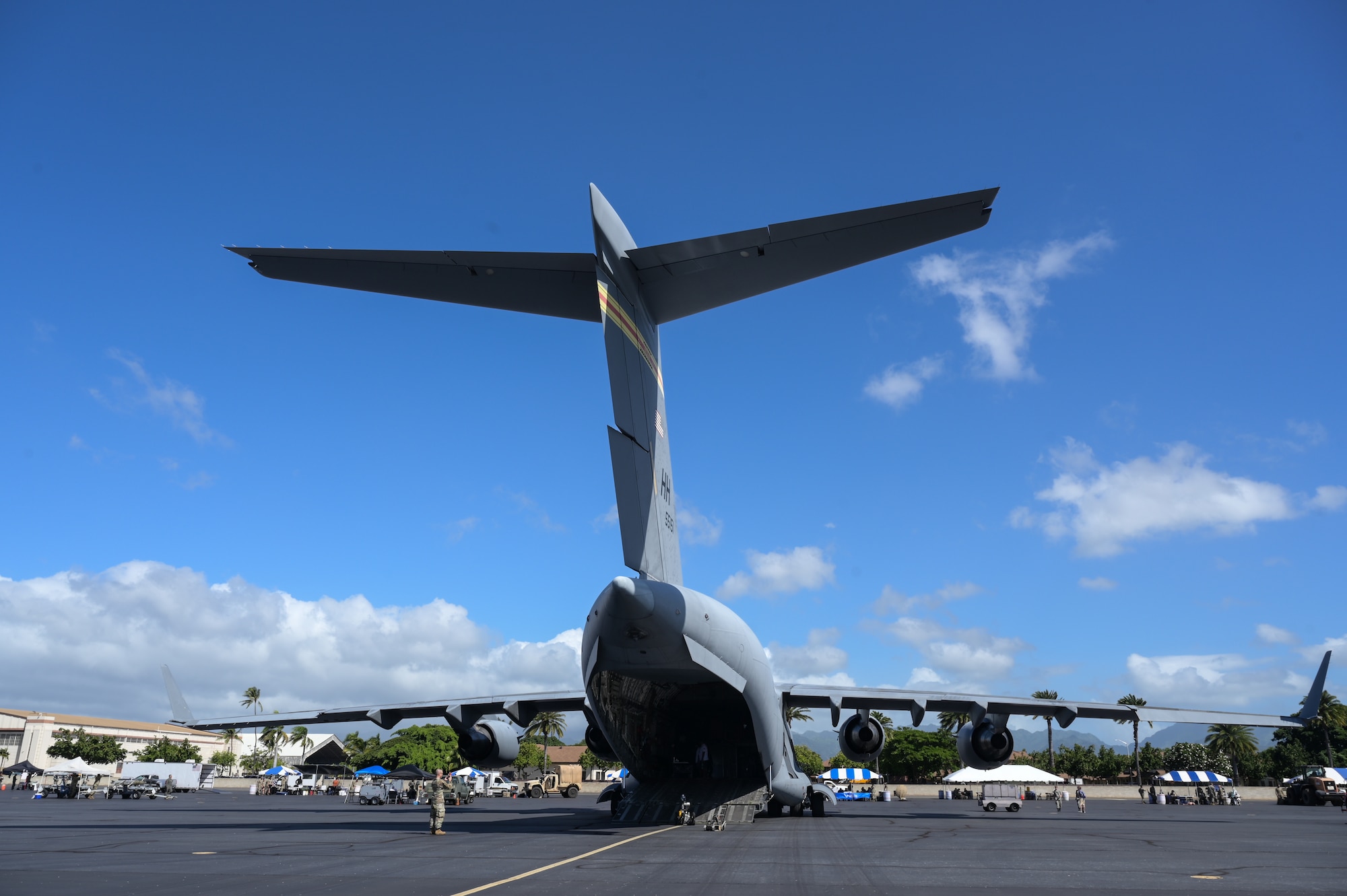 Students tour an aircraft on a flight line.