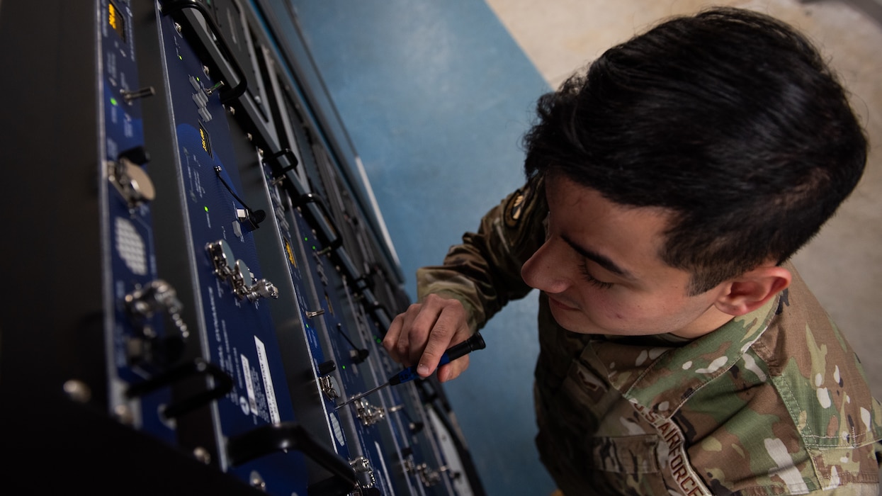 Airman performs tuning on radio equipment