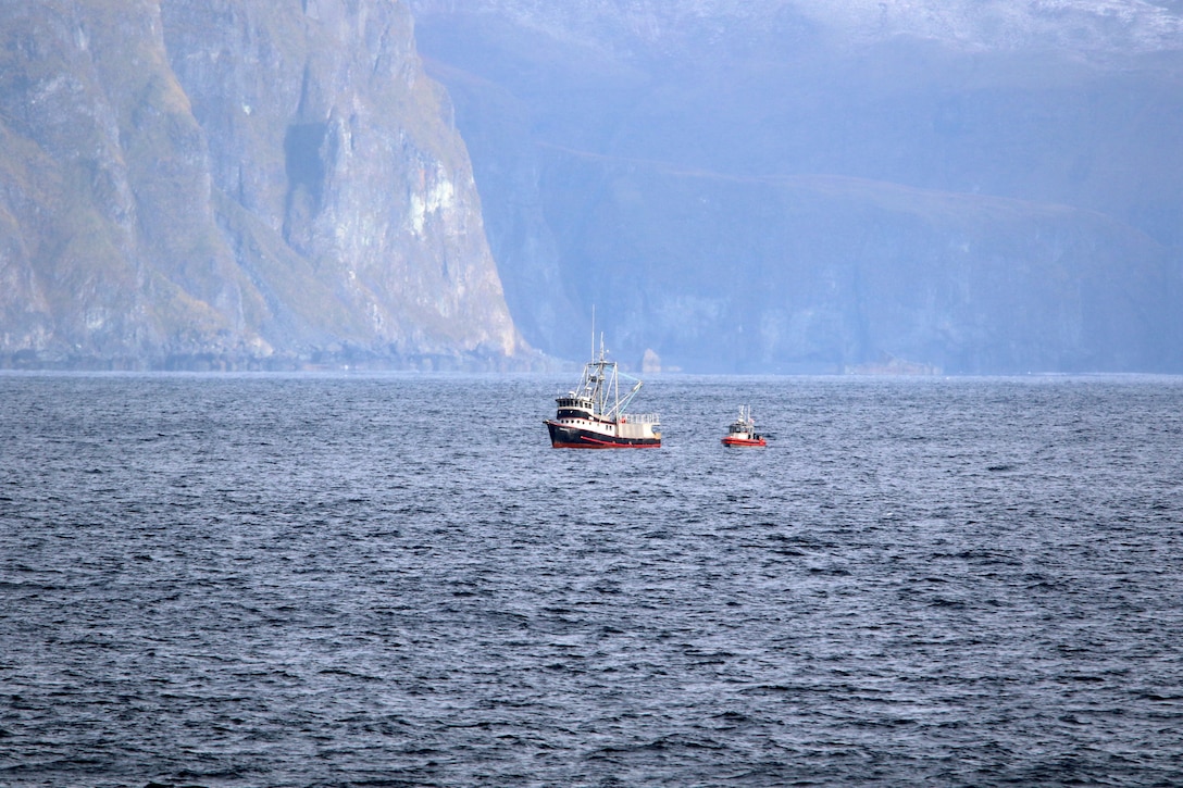 A Coast Guard Cutter Stratton (WMSL 752) small boat pulls alongside the disabled and adrift fishing vessel Galatea, Unalaska Island, Alaska, Oct. 13, 2024. Stratton responded to the Galatea, which was adrift in a storm without propulsion due to a severed engine cooling line and the crew deployed to the fishing vessel, repaired the casualty, and safely escorted Galatea to Dutch Harbor. U.S. Coast Guard courtesy photo.