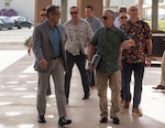 John Figuerres, Defense POW/MIA Accounting Agency acting deputy director for operations, welcomes retired U.S. Navy Adm. Harry Harris, former U.S. ambassador to South Korea and the 24th USINDOPACOM commander, and National Defense University CAPSTONE fellows during a DPAA tour at Joint Base Pearl Harbor-Hickam, Hawaii, Nov. 15, 2024.