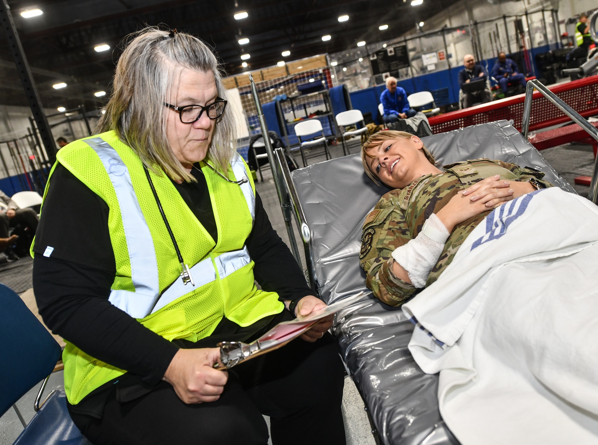 VA, EMS, Omaha Metropolitan Healthcare Coalition and 55th Medical Group personnel triage a patient during a National Disaster Medical System exercise at Offutt Air Force Base, Nebraska Nov. 13, 2024 . The Omaha area is conducting an exercise to determine the preparedness to support an overseas conflict by moving military casualties into the civilian health care network. Participants from local, state, and federal response agencies teamed up with Air Force and the Nebraska Air National Guard to ensure the nation’s capability to support a war effort. (U.S. Air Force photo by Chad Watkins)