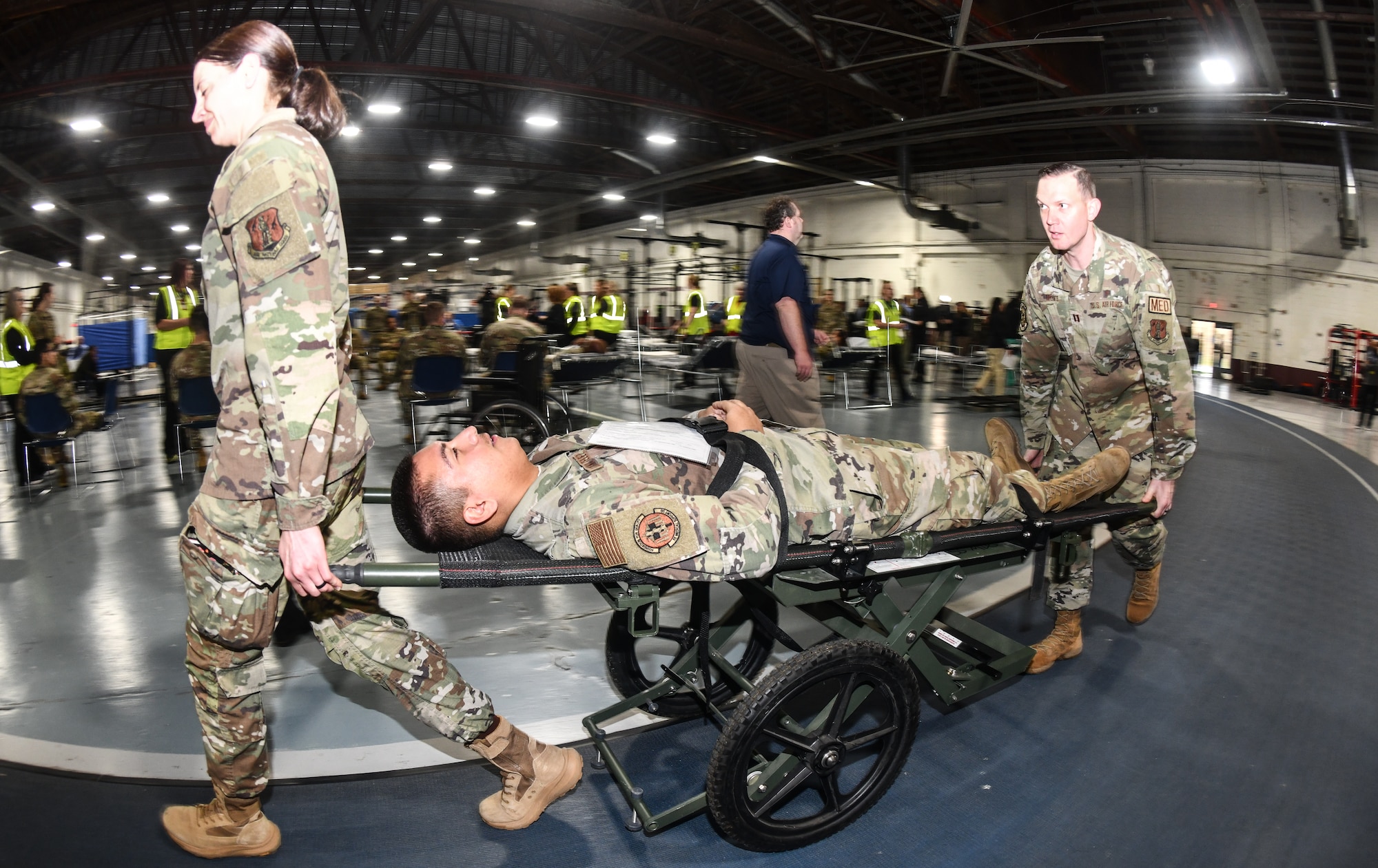 VA, EMS, Omaha Metropolitan Healthcare Coalition and 55th Medical Group personnel triage a patient during a National Disaster Medical System exercise at Offutt Air Force Base, Nebraska Nov. 13, 2024 . The Omaha area is conducting an exercise to determine the preparedness to support an overseas conflict by moving military casualties into the civilian health care network. Participants from local, state, and federal response agencies teamed up with Air Force and the Nebraska Air National Guard to ensure the nation’s capability to support a war effort. (U.S. Air Force photo by Chad Watkins)