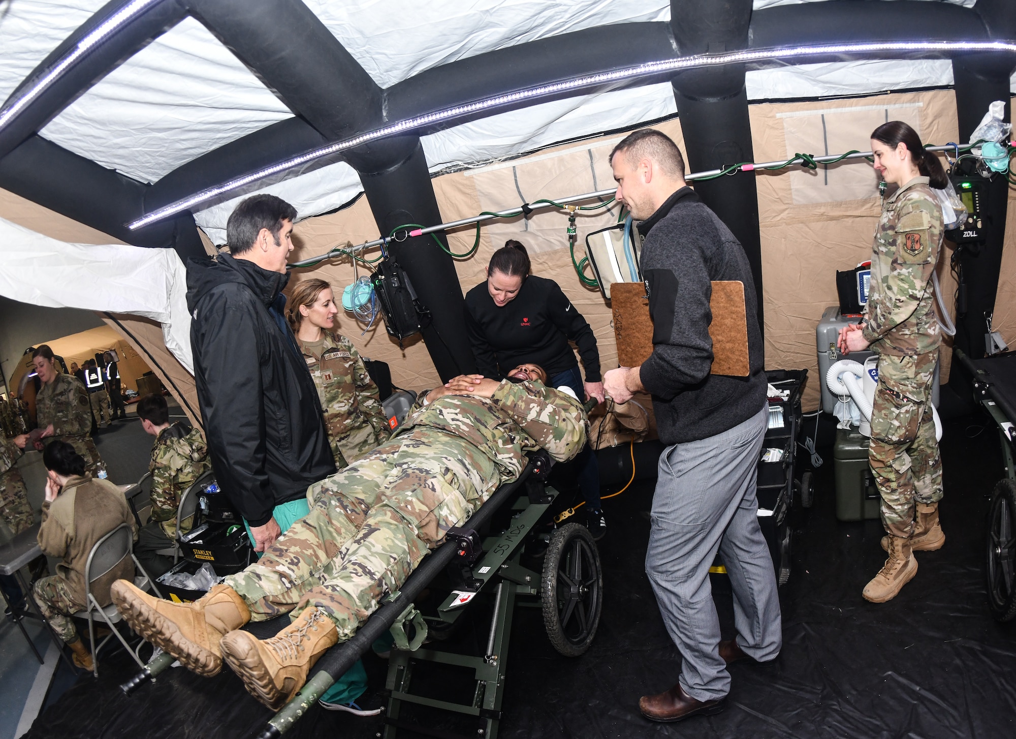 VA, EMS, Omaha Metropolitan Healthcare Coalition and 55th Medical Group personnel triage a patient during a National Disaster Medical System exercise at Offutt Air Force Base, Nebraska Nov. 13, 2024 . The Omaha area is conducting an exercise to determine the preparedness to support an overseas conflict by moving military casualties into the civilian health care network. Participants from local, state, and federal response agencies teamed up with Air Force and the Nebraska Air National Guard to ensure the nation’s capability to support a war effort. (U.S. Air Force photo by Chad Watkins)