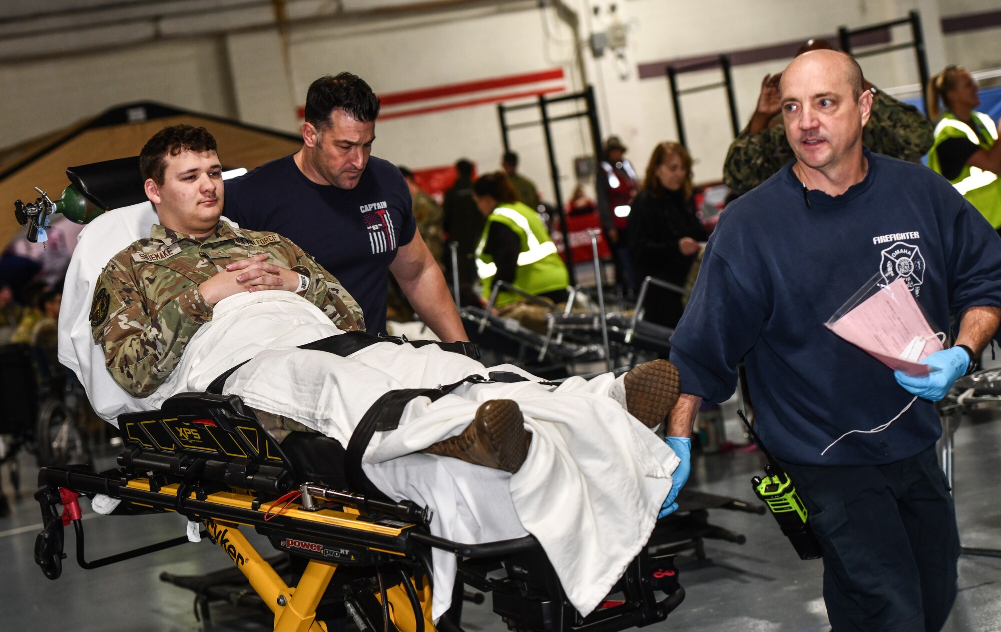 VA, EMS, Omaha Metropolitan Healthcare Coalition and 55th Medical Group personnel triage a patient during a National Disaster Medical System exercise at Offutt Air Force Base, Nebraska Nov. 13, 2024 . The Omaha area is conducting an exercise to determine the preparedness to support an overseas conflict by moving military casualties into the civilian health care network. Participants from local, state, and federal response agencies teamed up with Air Force and the Nebraska Air National Guard to ensure the nation’s capability to support a war effort. (U.S. Air Force photo by Chad Watkins)