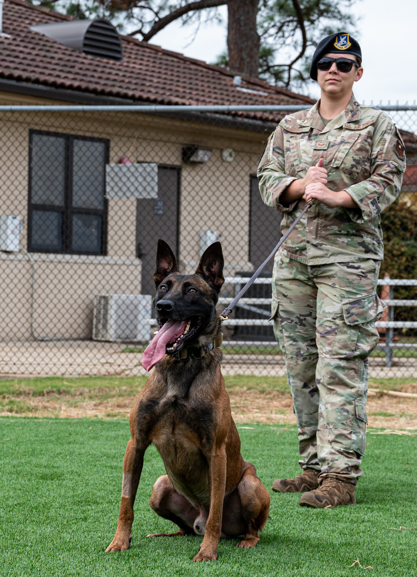 MWD handler and MWD pose for photo