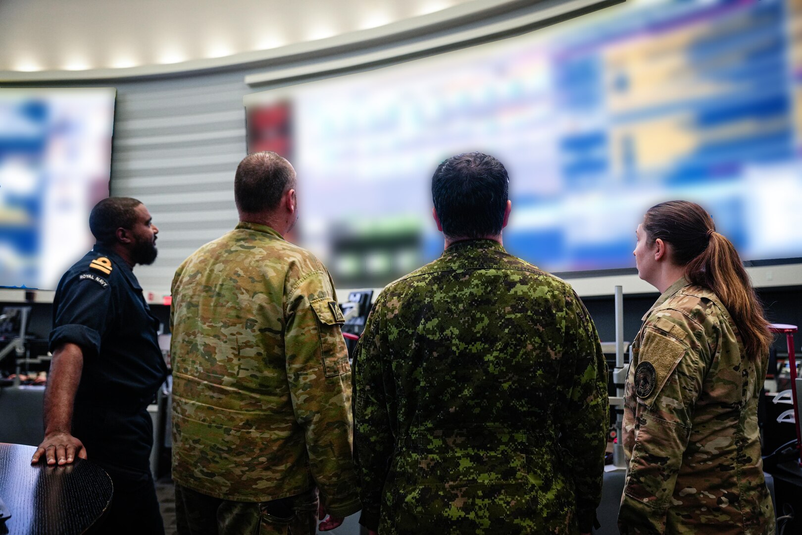 Four service members coordinate during an INCCA.