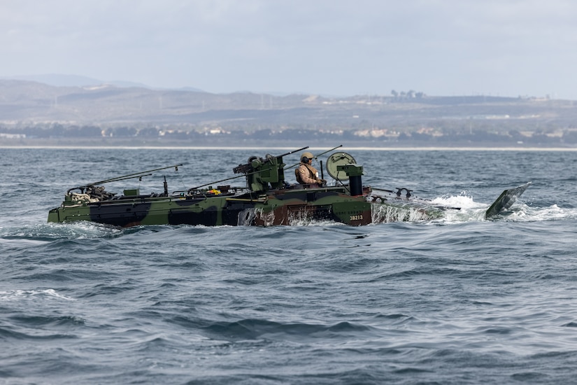 An amphibious vehicle floats at sea.