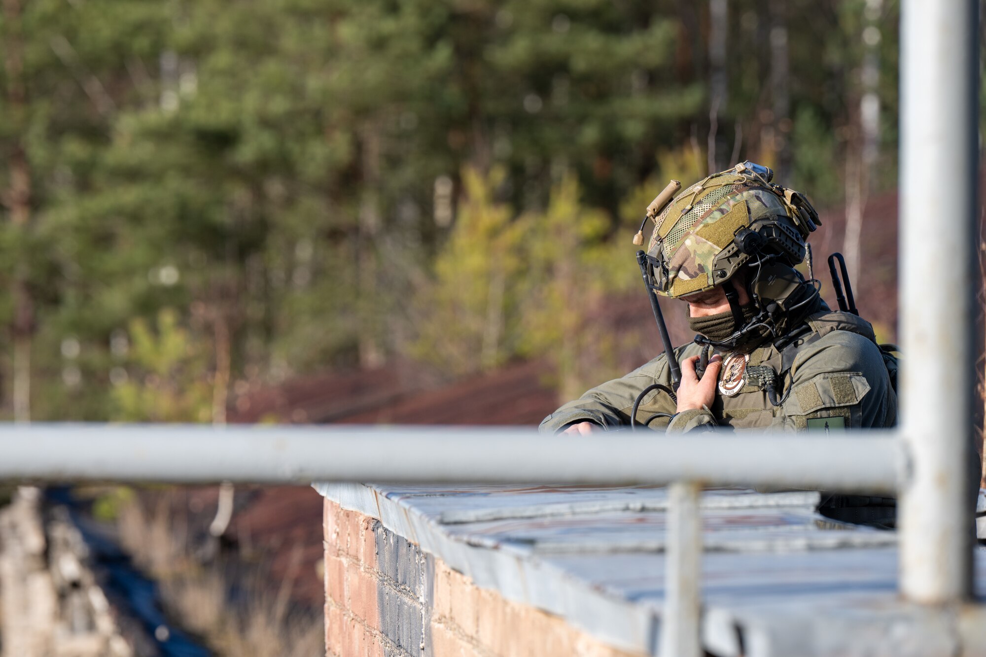 A photo of a soldier on the radio.