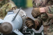 Airman assemble GBU-38 Joint Direct Attack Munitions