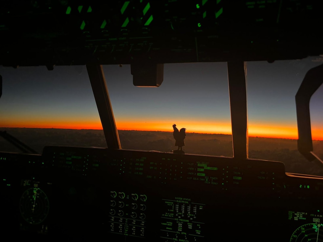 A U.S. Coast Guard Air Station Barbers Point HC-130 Hercules airplane crew flies over the Pacific Ocean for a medivac on Midway Atoll, Nov. 17, 2024. The U.S. Coast Guard responded to a medivac request for a man experiencing symptoms of a stroke or seizure on Midway Atoll. (U.S. Coast Guard photo by Cmdr. Victor Yaguchi)