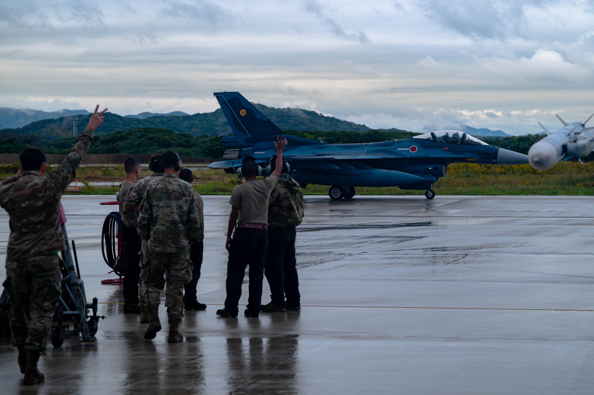 A Japan Air Self-Defense Force Mitsubishi F-2 taxis by U.S. Air Force Airmen with the 77th Expeditionary Fighter Generation Squadron at Tsuiki Air Base, Japan, during Keen Sword 25, Oct. 28, 2024.