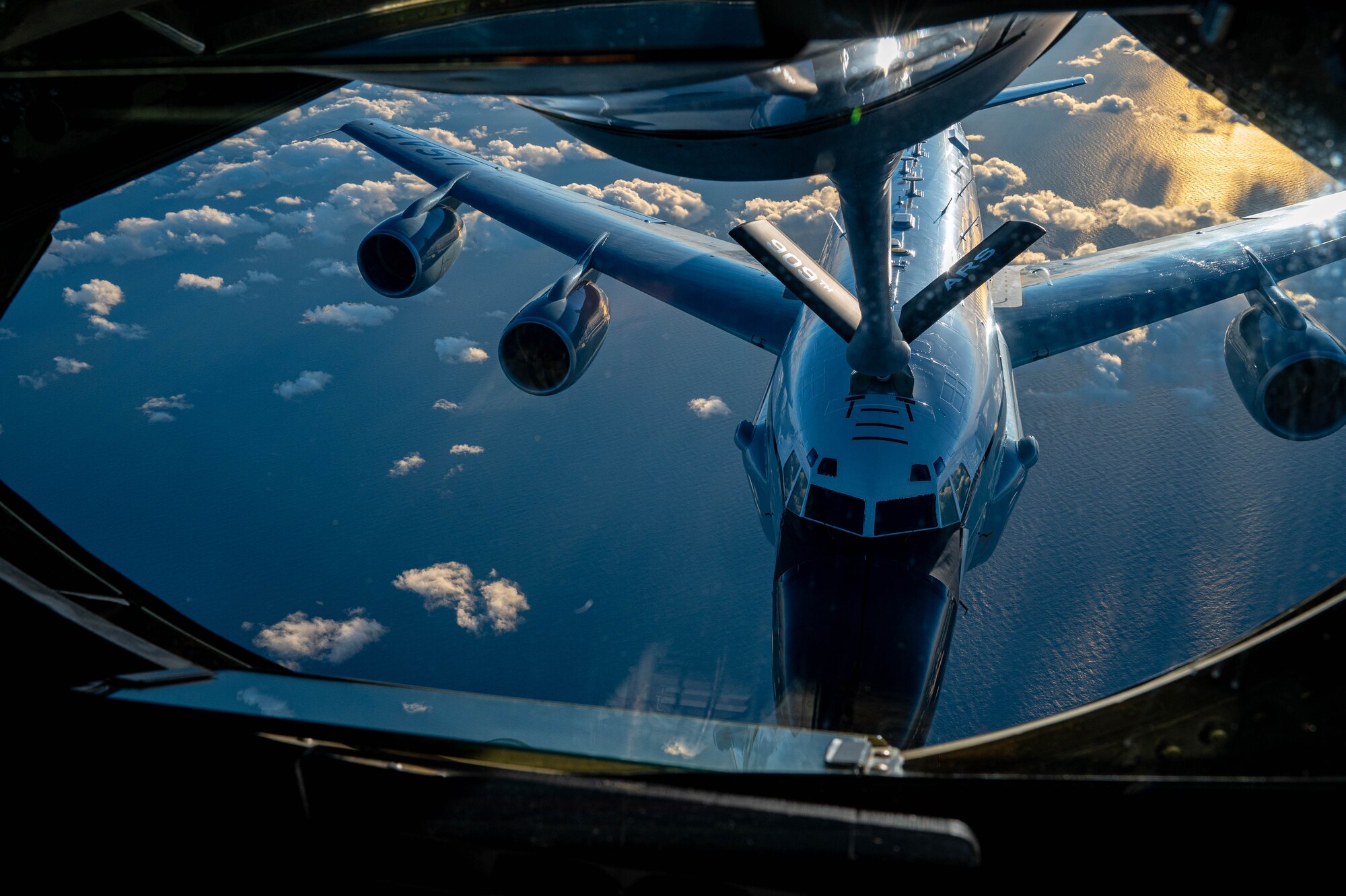 A U.S. Air Force RC-135 Rivet Joint assigned to the 84th Reconnaissance Squadron conducts aerial refueling with a KC-135 Stratotanker assigned to the 909th Air Refueling Squadron over the Japanese coastline, Nov. 8, 2024.