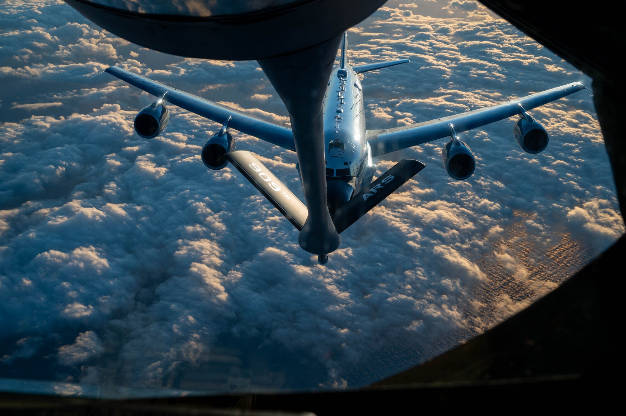 A U.S. Air Force RC-135 Rivet Joint assigned to the 84th Reconnaissance Squadron conducts aerial refueling with a KC-135 Stratotanker assigned to the 909th Air Refueling Squadron over the Japanese coastline, Nov. 8, 2024.