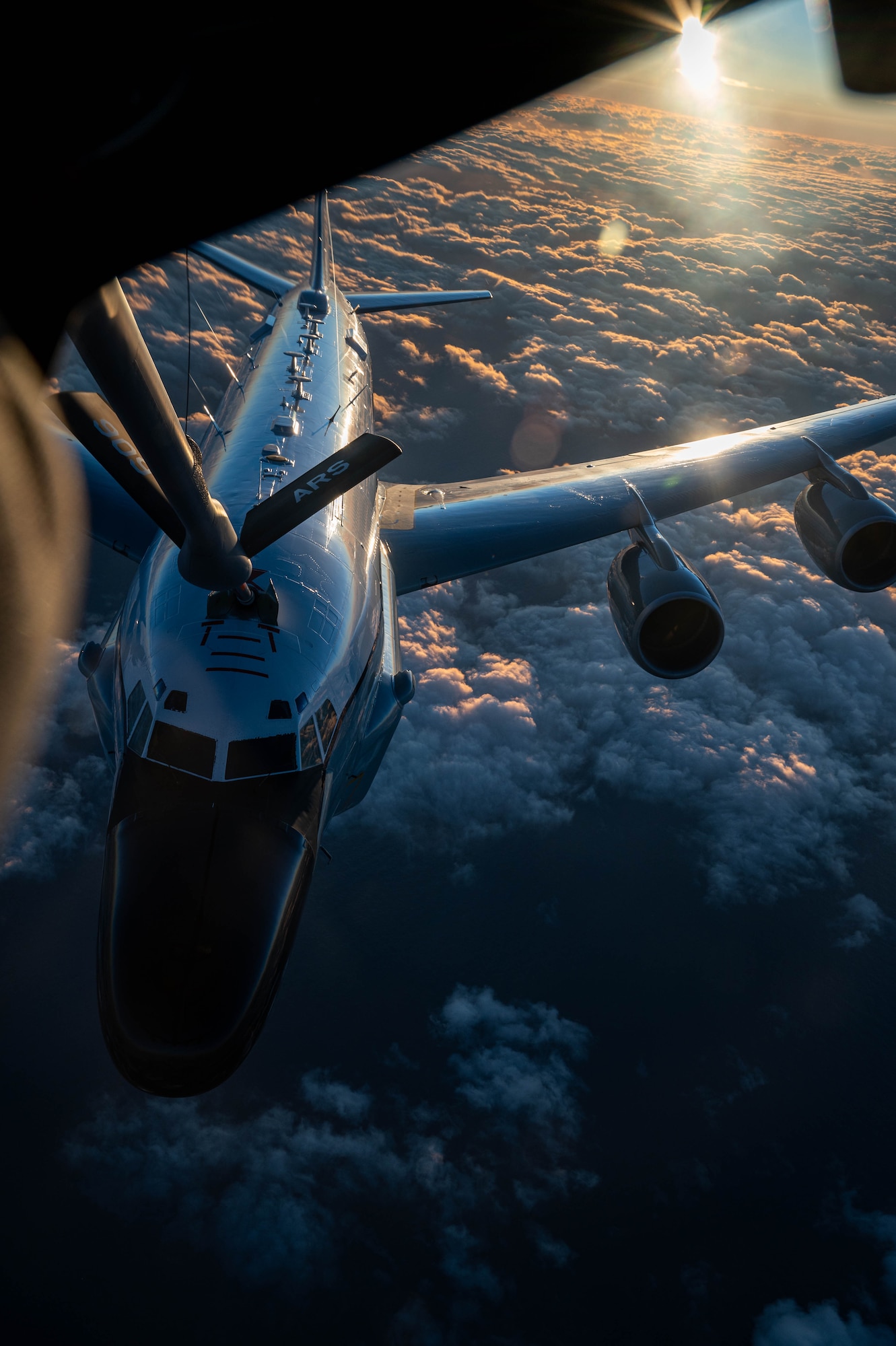 A U.S. Air Force RC-135 Rivet Joint assigned to the 84th Reconnaissance Squadron conducts aerial refueling with a KC-135 Stratotanker assigned to the 909th Air Refueling Squadron over the Japanese coastline, Nov. 8, 2024.