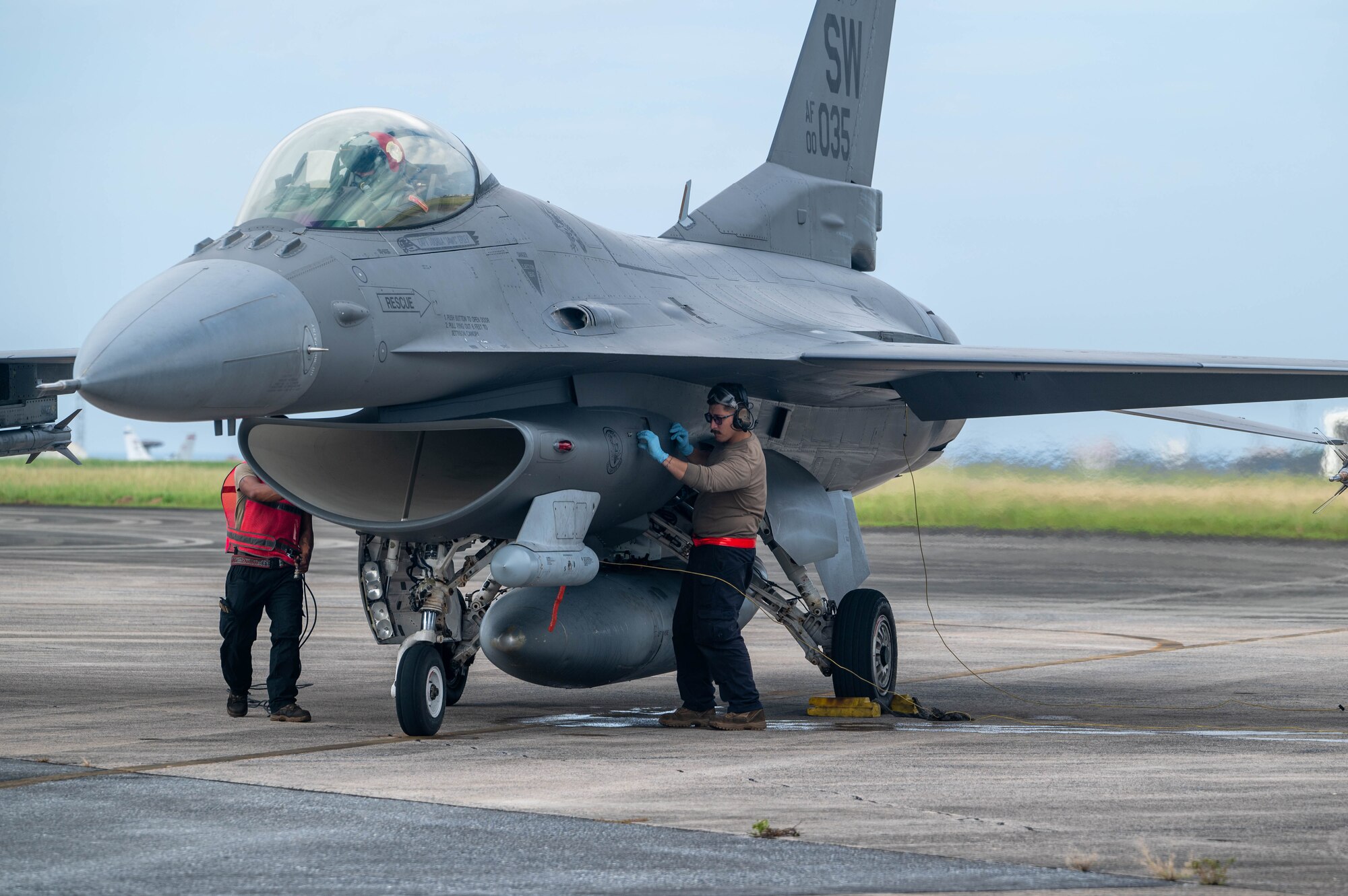 U.S. Air Force Airmen from the 77th Expeditionary Fighter Generation Squadron conduct preflight inspections on a F-16 Fighting Falcon during a communication outage exercise at Kadena Air Base, Japan, Nov. 14, 2024.