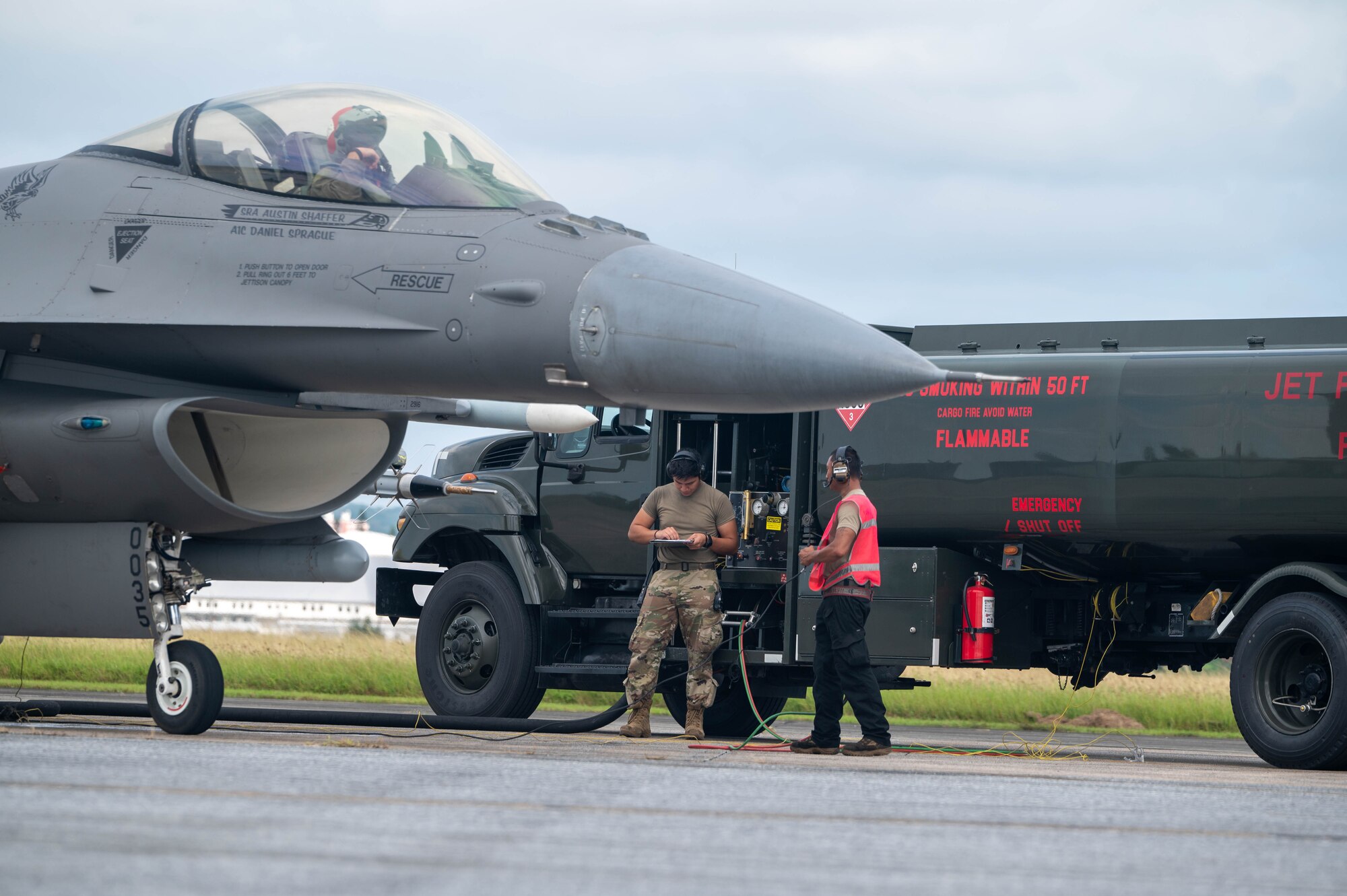 U.S. Air Force Airmen from the 77th Expeditionary Fighter Generation Squadron conduct hot pit refueling for an F-16 Fighting Falcon on the flightline during a communication outage exercise at Kadena Air Base, Japan, Nov. 14, 2024.