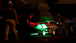 U.S. Navy Sailors load ordnance into an F-35C Lightning II, attached to Marine Fighter Attack Squadron (VMFA) 314, the flight deck of the Nimitz-class aircraft carrier USS Abraham Lincoln (CVN 72