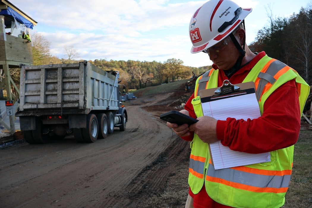 Man reviews data at temporary debris site