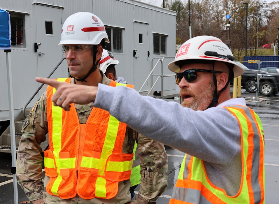 Two men discus water purification