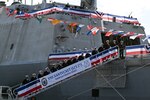 The crew of the newest Freedom-variant littoral combat ship USS Nantucket (LCS 27) brings the ship to life during the commissioning ceremony for USS Nantucket in Boston.