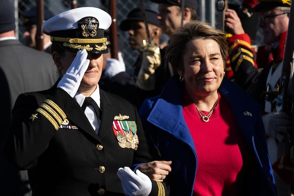 Cmdr. Kari Yakubisin USS Nantucket (LCS 27) escorts Massachusetts Gov. Maura Healey during the commissioning ceremony for USS Nantucket in Boston.