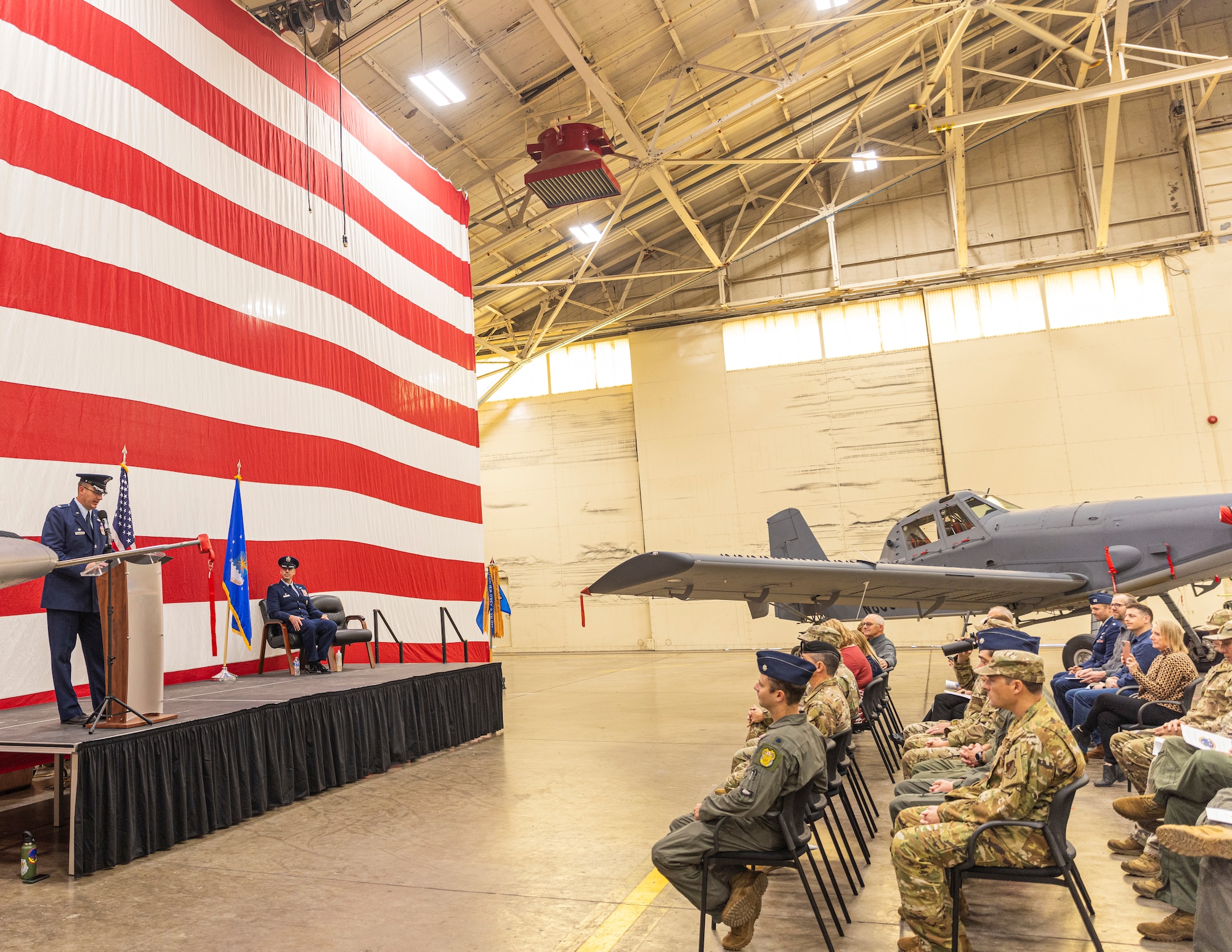 Photo of Lt. Col. Jesse Ziegler, 17th Special Operations Squadron commander, providing remarks to an audience of military members at a ceremony.