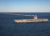 The Nimitz-class aircraft carrier USS George H.W. Bush (CVN 77), transits to Naval Station Norfolk after on-time completion of an 11-month maintenance period at Norfolk Naval Shipyard and sea trials, Nov. 16, 2024.