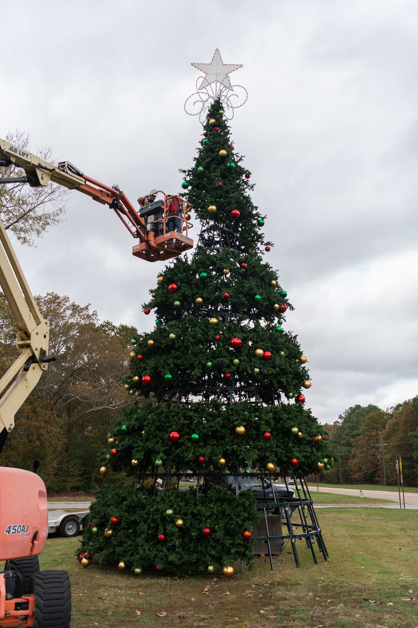 Craft personnel at Arnold Air Force Base, Tenn., work Nov. 5, 2024, to construct the large Christmas tree located just inside the Arnold AFB Main Gate. A lighting ceremony for the tree will take place at Arnold on Dec. 3 at 4 p.m. (U.S. Air Force photo by Keith Thornburgh)