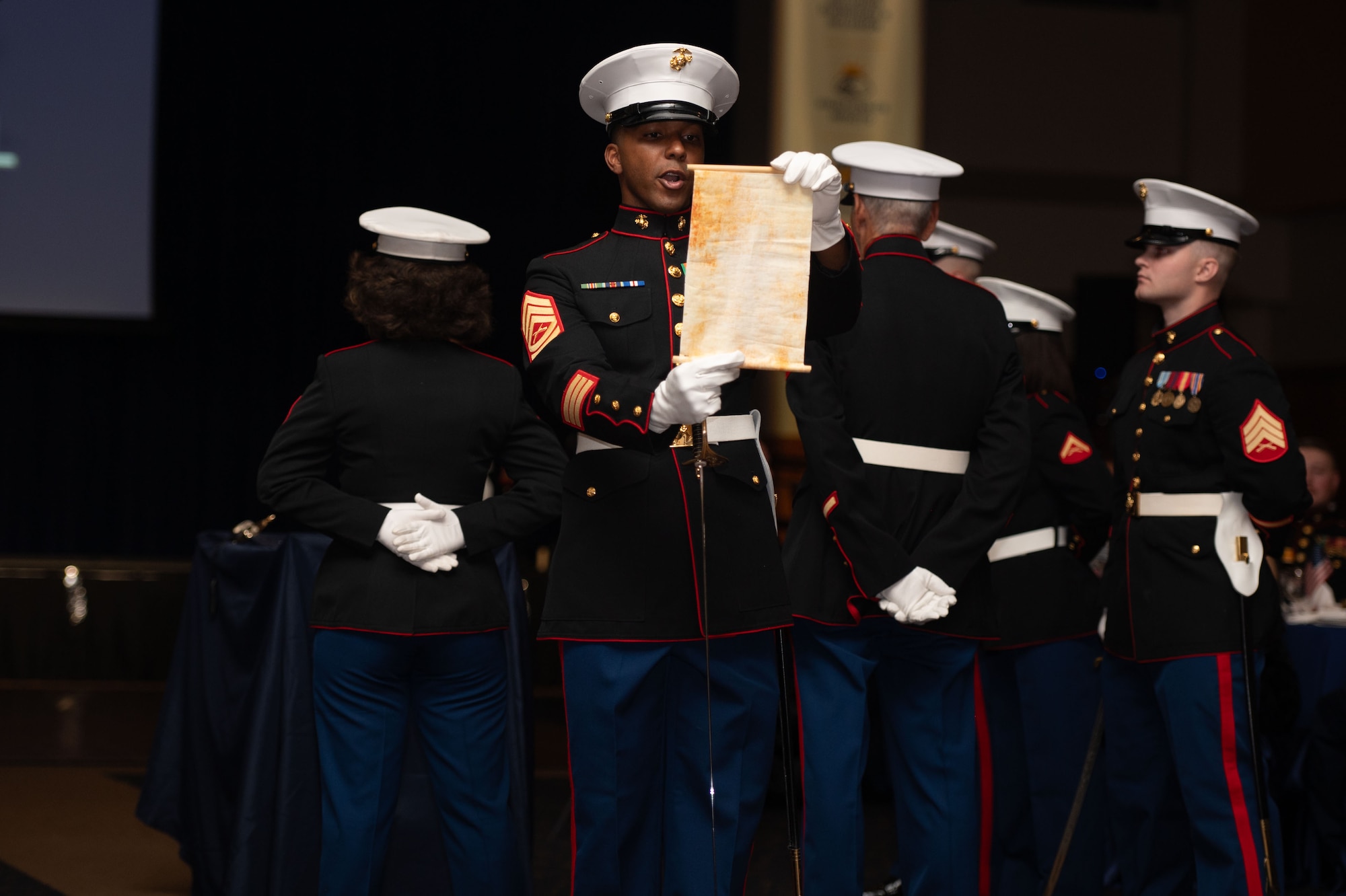 U.S. Marine Corps Gunnery Sgt. Kenny Jules, Expeditionary Firefighting and Rescue specialist, reads off Marine Corps Order No. 47 during the 249th Marine Corps Ball at the CJ Davidson Conference Center in San Angelo, Texas, Nov. 9, 2024. Marine Corps Order No. 47 is a birthday message written by Maj. Gen. John A. Lejeune, the 13th Commandant of the U.S. Marine Corps. (U.S. Air Force photo by Airman 1st Class Brian Lummus)