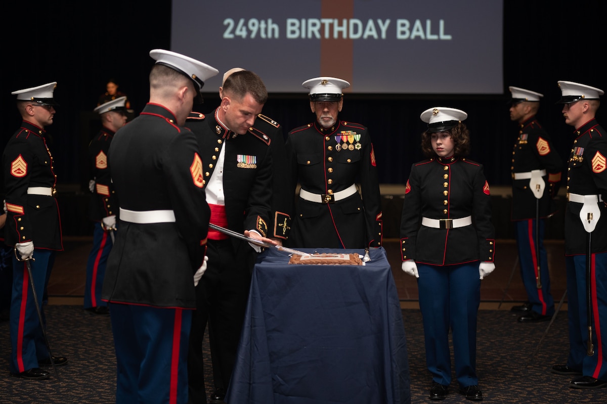 U.S. Marine Corps Lt. Col. Brian Meade, Marine Corps Detachment Goodfellow commanding officer, cuts the Marine Corps birthday cake during the 249th Marine Corps Ball at the CJ Davidson Conference Center in San Angelo, Texas, Nov. 9, 2024. It is tradition for the oldest and youngest Marines to get the first slices of cake during the cake-cutting ceremony. (U.S. Air Force photo by Airman 1st Class Brian Lummus)