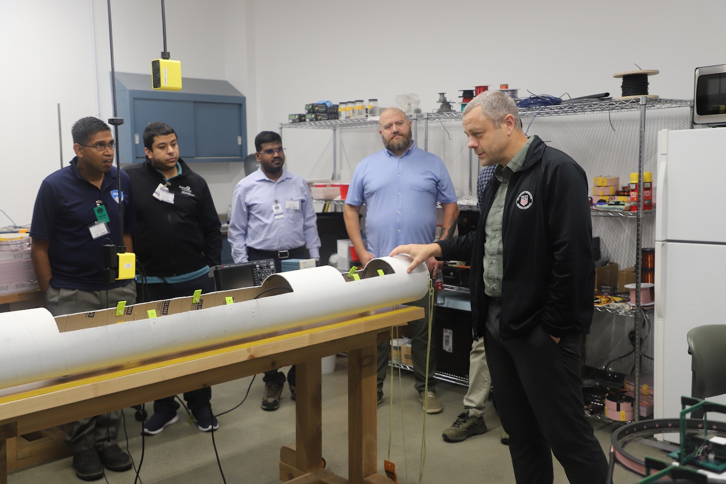 CRREL Research Electrical Engineer Dr. Benjamin Barrowes shows Rowan University students The In-Flight Rapid Observation and Surveying Tool, or iFROST, which is designed to be a remote sensor deployed on uncrewed aerial systems to detect, survey and map large areas of permafrost regions.