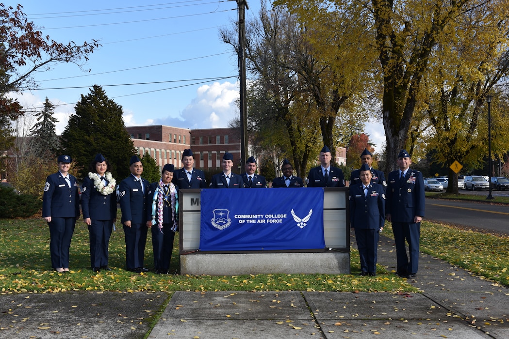 CCAF graduates stand for a photo with 62d AW leadership.