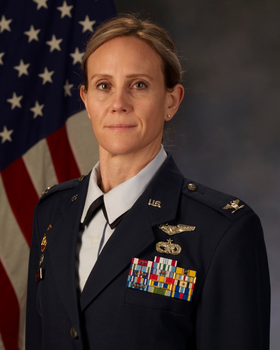 official photo in front of U.S. flag