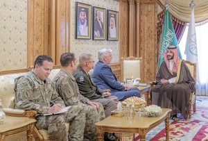 Indiana Gov. Eric Holcomb, center, and Maj. Gen. Dale Lyles, Indiana National Guard adjutant general, met with the Minister of Defense for the Kingdom of Saudi Arabia, His Royal Highness Khalid bin Salman, right, Nov. 18, 2024, to discuss shared interests and how the partnership will benefit the National Guard and the Kingdom of Saudi Arabia.