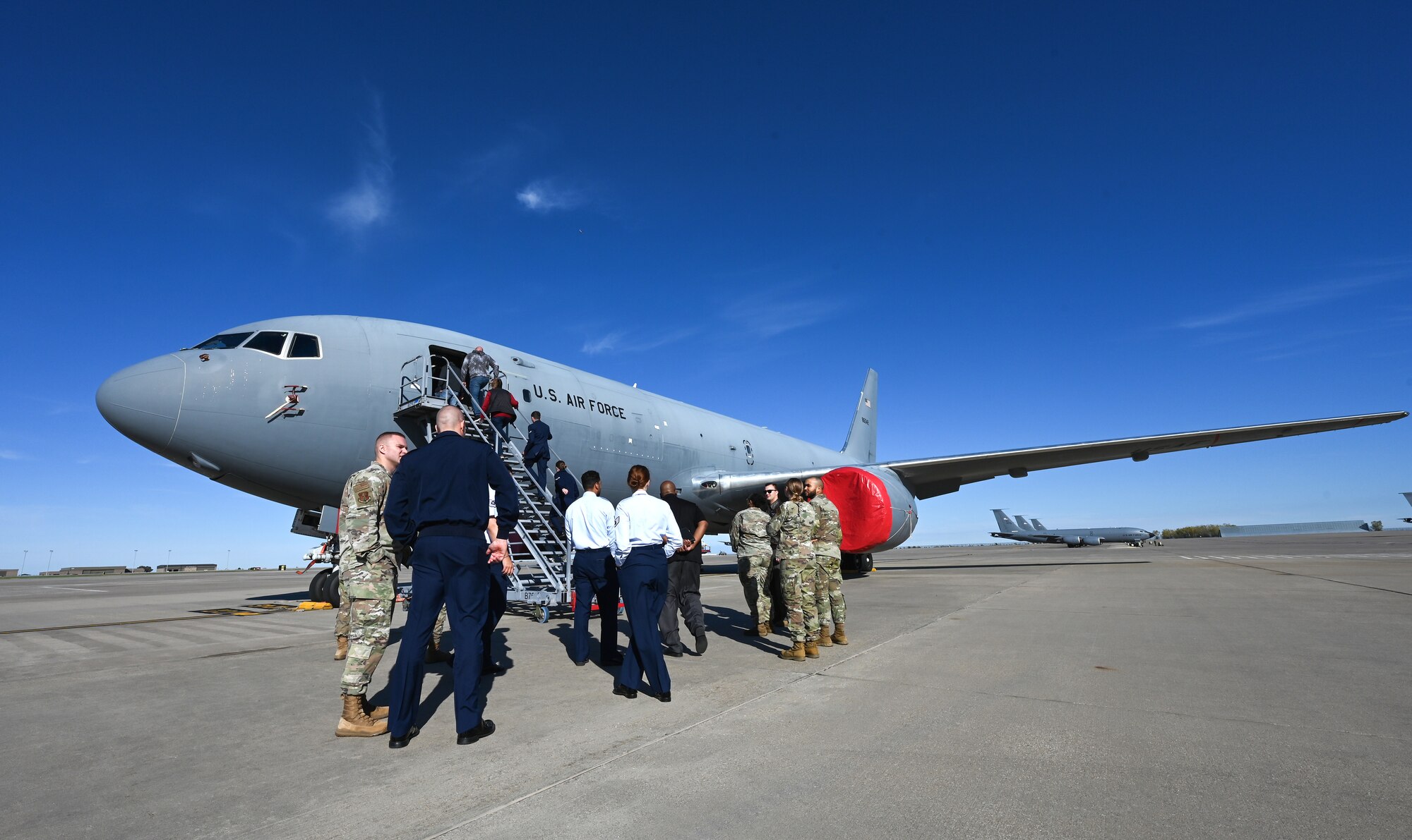 Kansas active duty, Guard and Reserve recruiters and local high school and college professionals tour a KC-46A Pegasus static display during a base tour Nov. 6, 2024, at McConnell Air Force Base, Kansas. The purpose of the tour was to offer deeper insight into life in the military for local guidance counselors and military liaisons, as well as provide an opportunity for them to develop working relationships with active duty, Guard and Reserve recruiters. (U.S. Air Force photo by Staff Sgt. Tryphena Mayhugh)