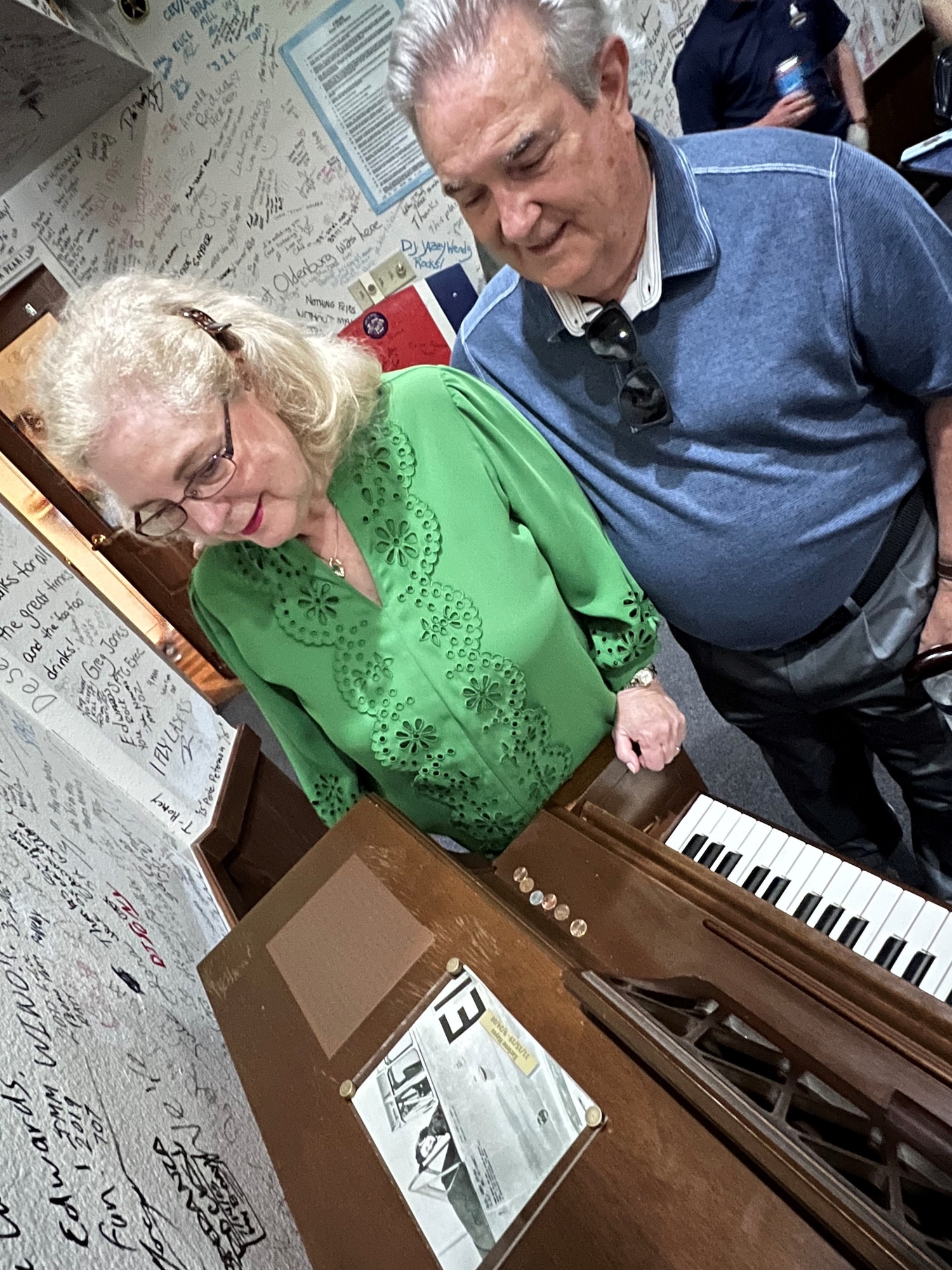 Terri Hayes and husband James look at the newly installed dedication plaque and photo of James’ mother.