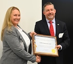 Lochli awards certificate to AM General