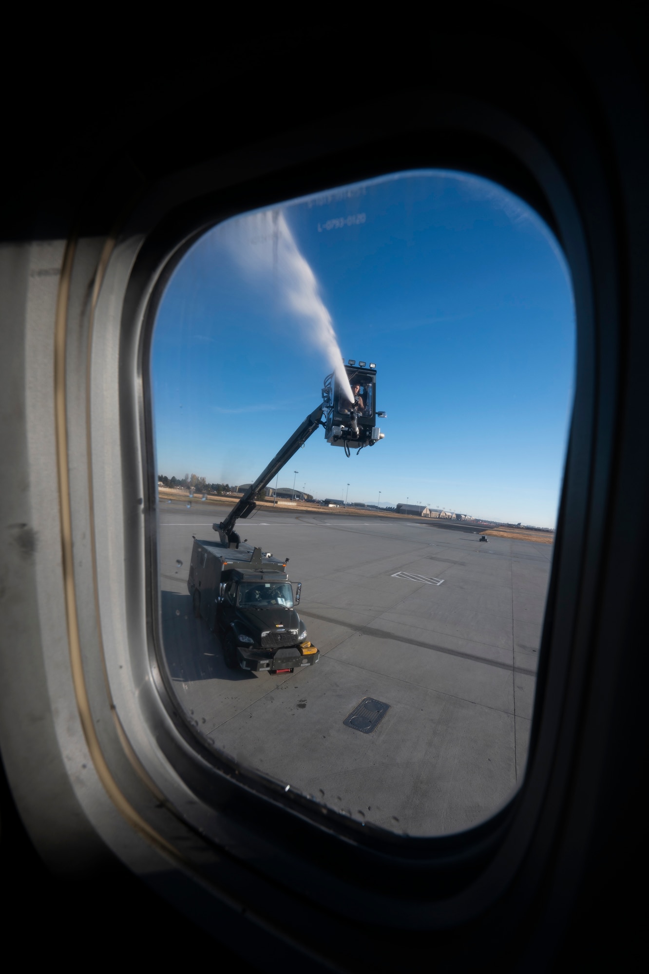 A plane gets de-iced.