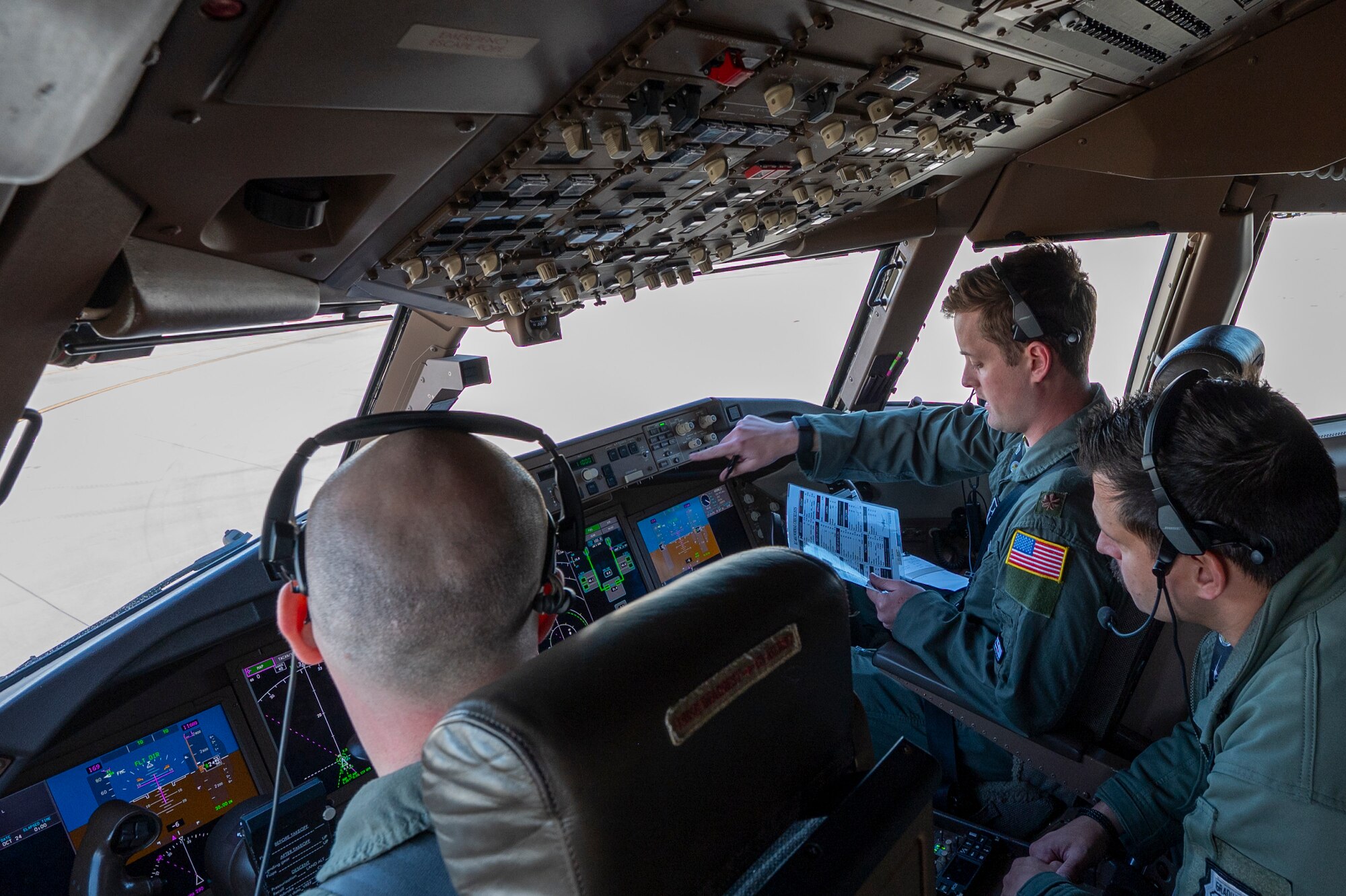 Pilots perform pre-flight inspections.