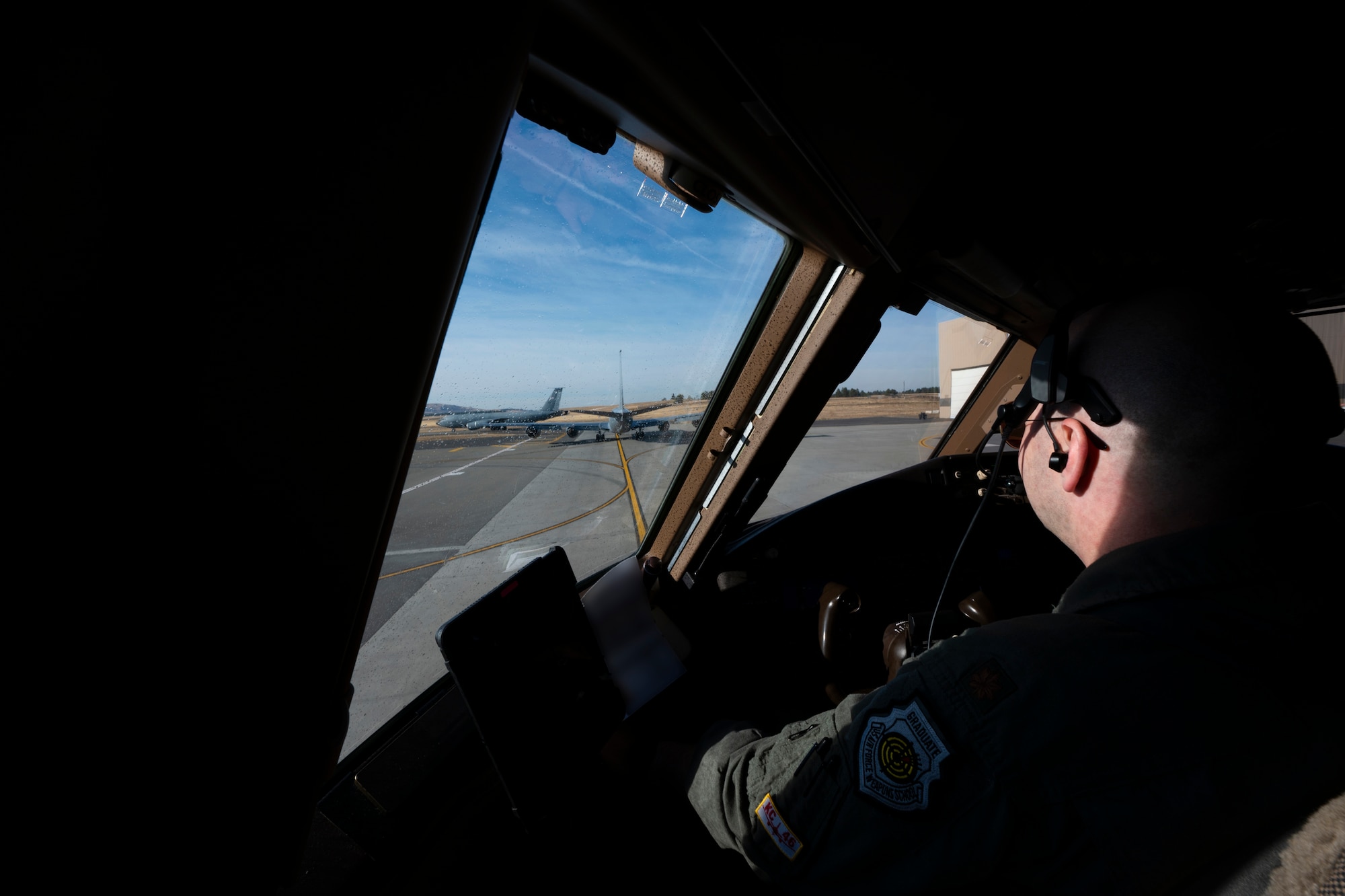 A pilot taxis an airplane.