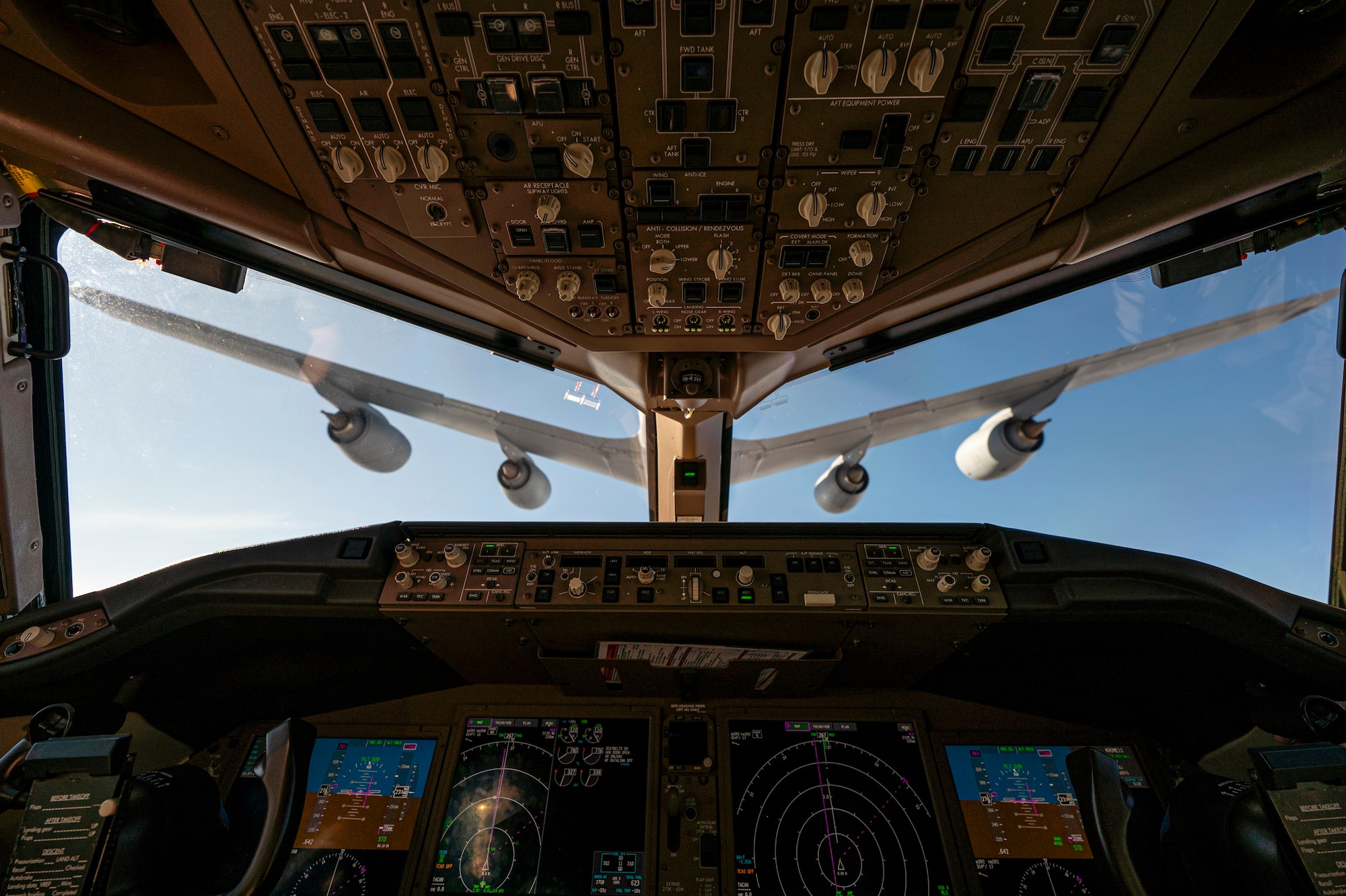 An airplane refuels another airplane.